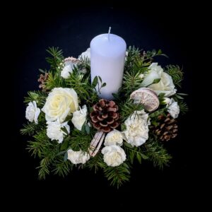 Christmas candle centrepiece with white roses and greenery