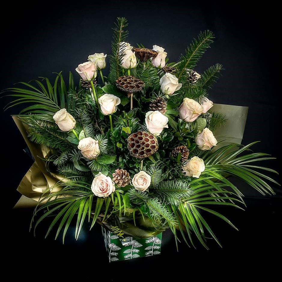 Elegant Christmas flower arrangement with white roses