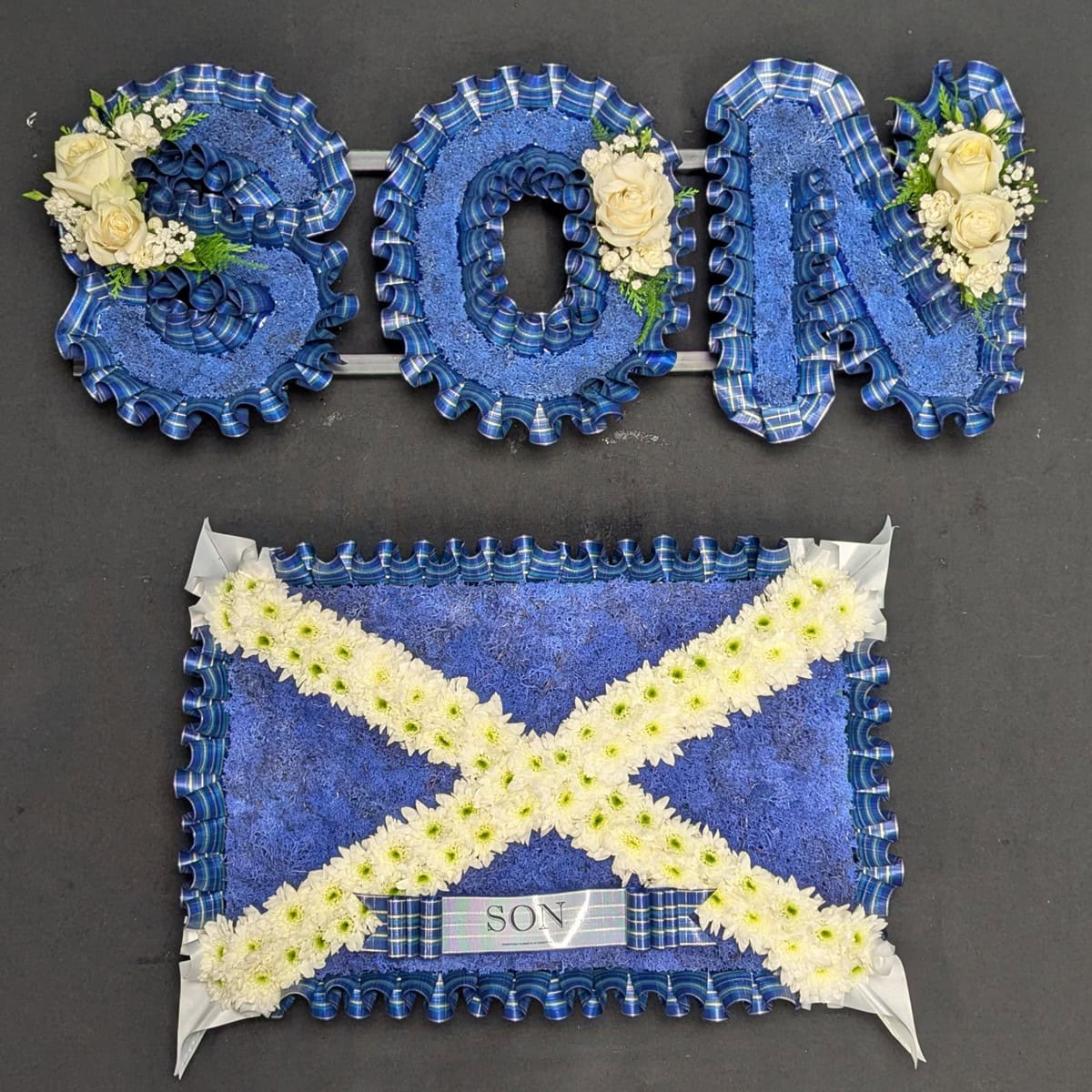 Scottish funeral flowers arrangement with tartan