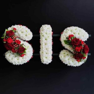 Funeral tribute letters in white and red flowers