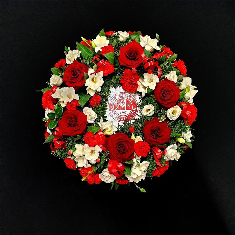 Aberdeen Football Club themed funeral wreath with red roses and white flowers