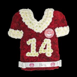 Floral tribute in the shape of an Aberdeen football shirt