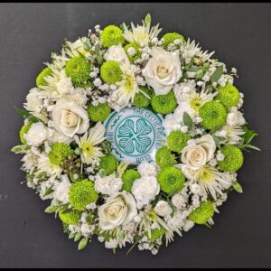 Celtic Football Club themed funeral wreath with green and white flowers.