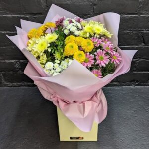 Cheerful chrysanthemum bouquet in yellow, white and pink wrapped in blush paper in a gift box – Anastasia Florists Aberdeen