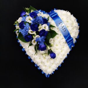 White chrysanthemum heart funeral tribute with blue and white flowers and blue Dad ribbon on a black background