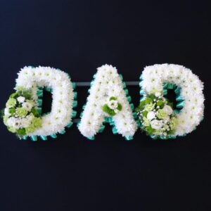 DAD funeral letter tribute with white chrysanthemums, green ribbon edging and green and white flower sprays