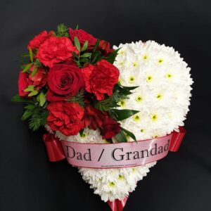White chrysanthemum heart funeral tribute with red roses, carnations and Dad / Grandad ribbon on a black background