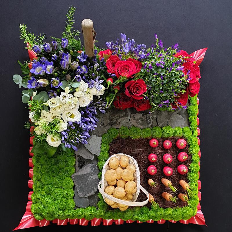 Funeral tribute with flowers and vegetables