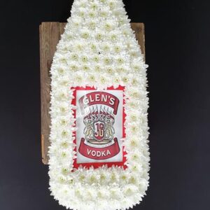 Funeral floral tribute in the shape of a vodka bottle