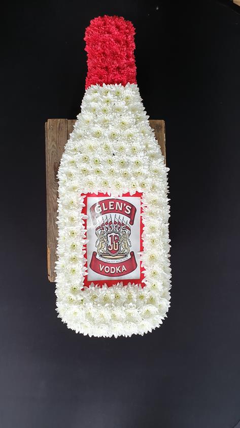 Funeral floral tribute in the shape of a vodka bottle