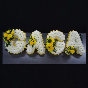 Gaga funeral letter tribute with white and yellow flowers