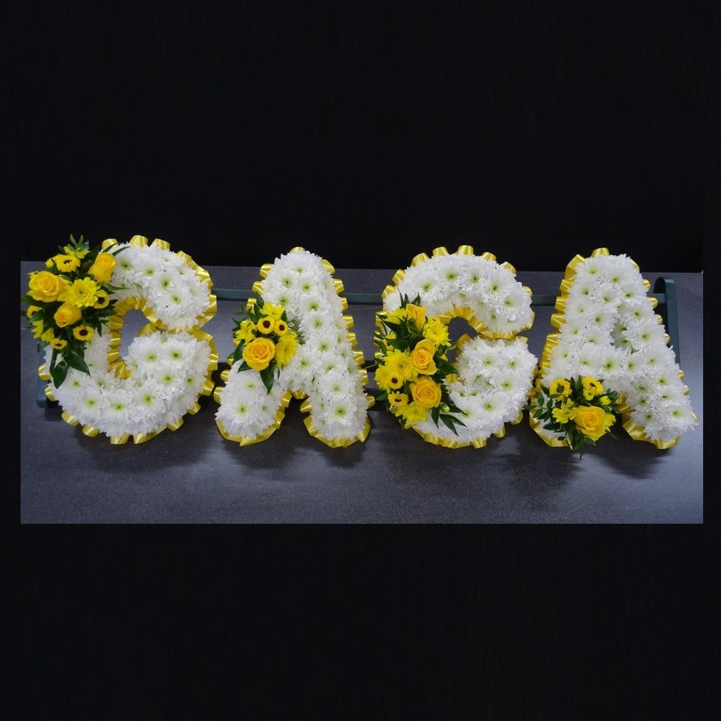 Gaga funeral letter tribute with white and yellow flowers