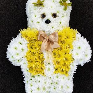 Yellow and white teddy bear funeral tribute made from chrysanthemums with satin bow from Anastasia Florists Aberdeen.