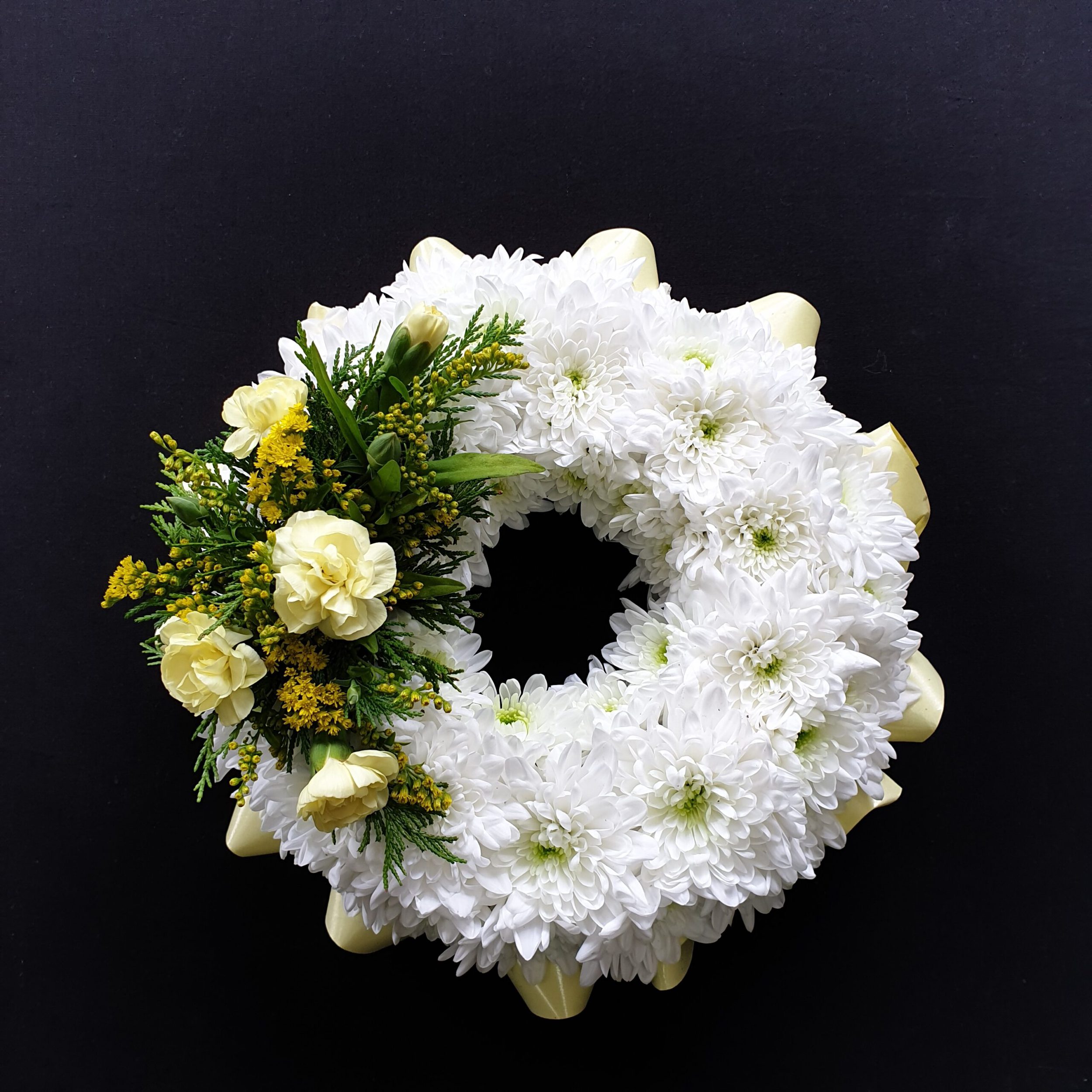 Miniature wreath with white flowers and greenery