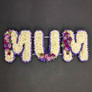 MUM funeral letter tribute with white chrysanthemums, purple ribbon edging and lilac and purple flower sprays