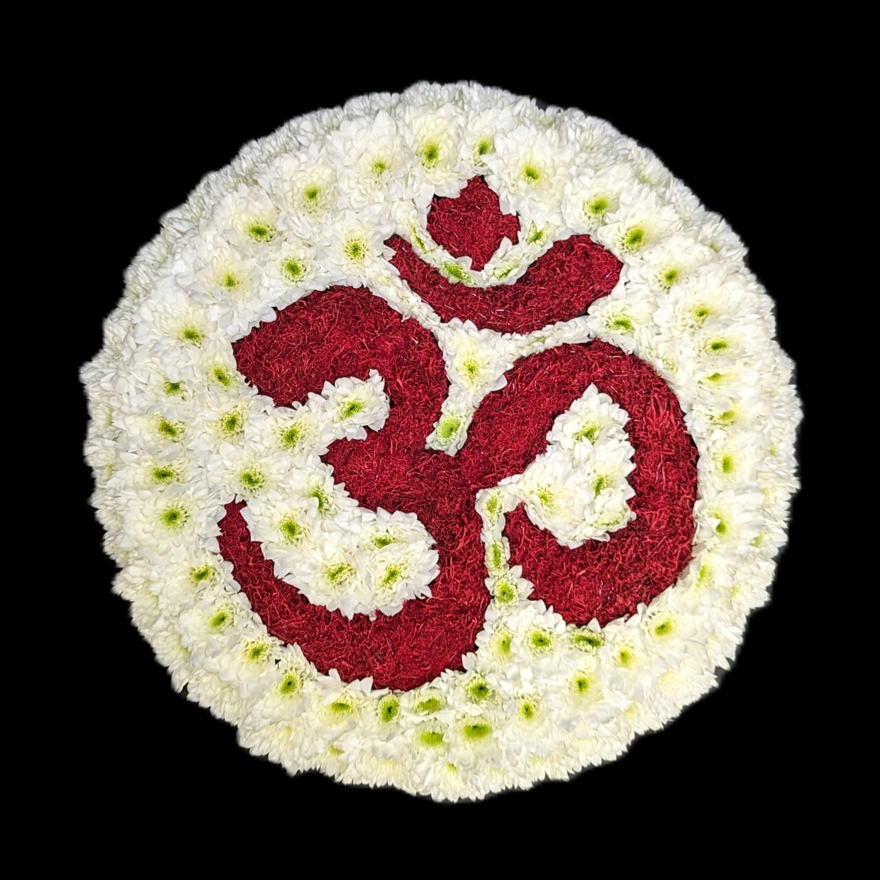 Round funeral tribute with red Om symbol on a white chrysanthemum base