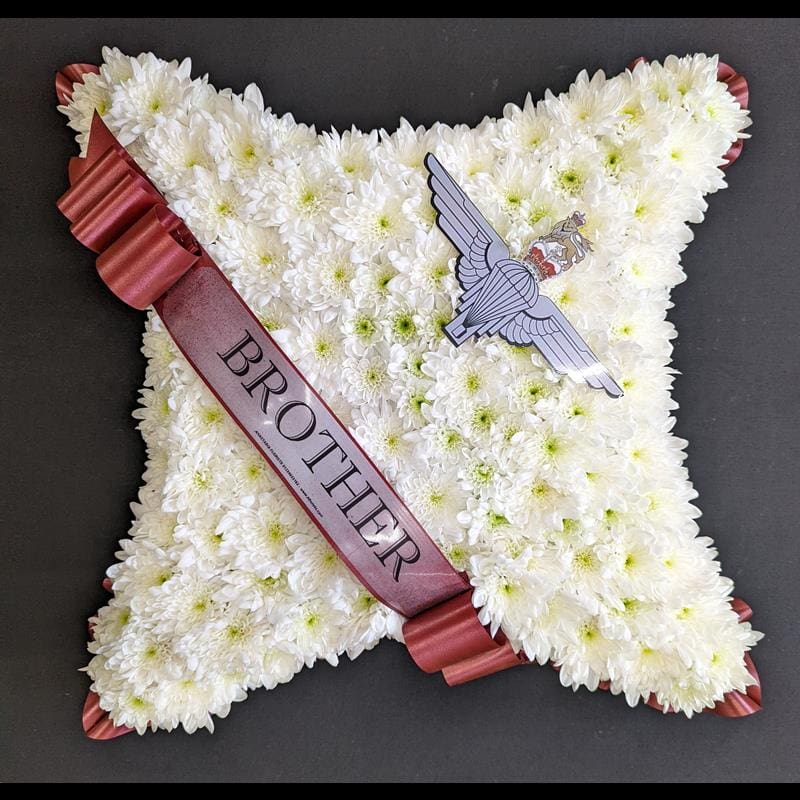 Brother Parachute Regiment funeral cushion tribute with white chrysanthemums and burgundy ribbon