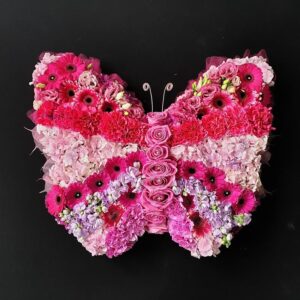 Pink butterfly funeral tribute made from roses, gerberas, carnations and mixed flowers from Anastasia Florists Aberdeen.