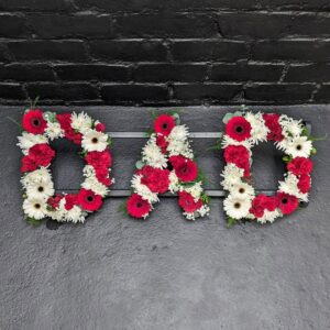 Red and white DAD funeral letter tribute with gerberas, carnations and roses