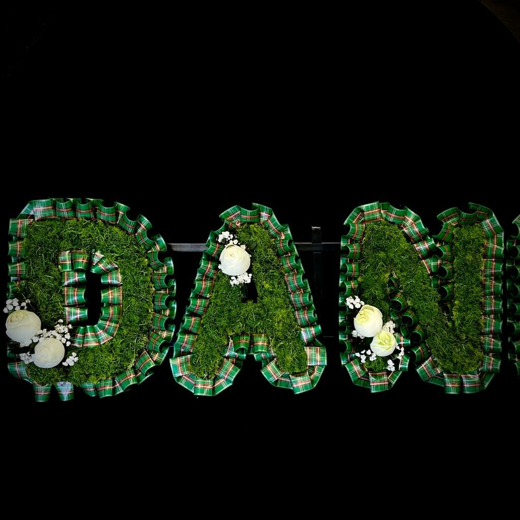 Scottish tartan DAD funeral letter tribute with moss letters and white roses