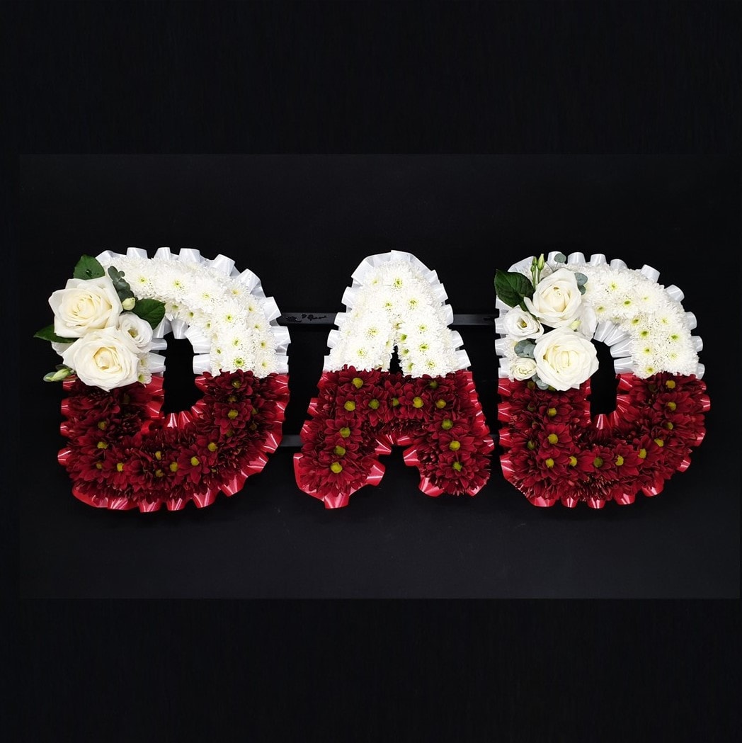 Two-tone red and white DAD funeral letter tribute with chrysanthemums and white roses