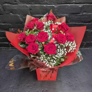Valentine’s bouquet of a dozen red roses with gypsophila in a red gift box from Anastasia Florists Aberdeen