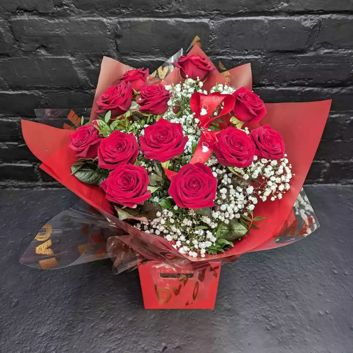 Valentine’s bouquet of a dozen red roses with gypsophila in a red gift box from Anastasia Florists Aberdeen