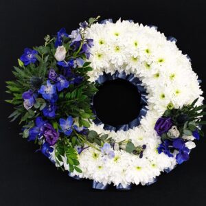 White and blue funeral flower wreath