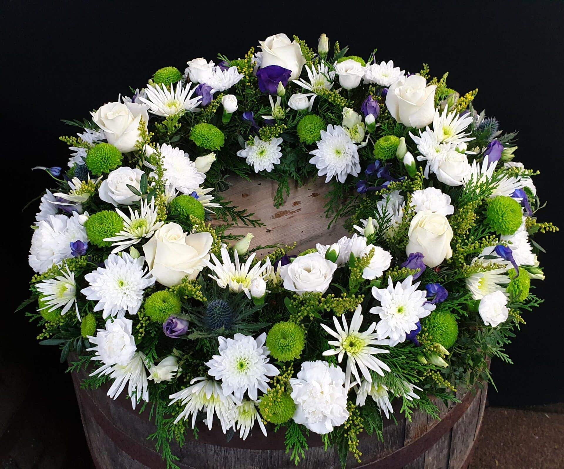 White rose and Purple Statice funeral wreath tribute