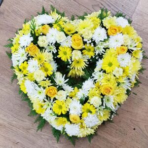Yellow and white floral heart tribute for funeral